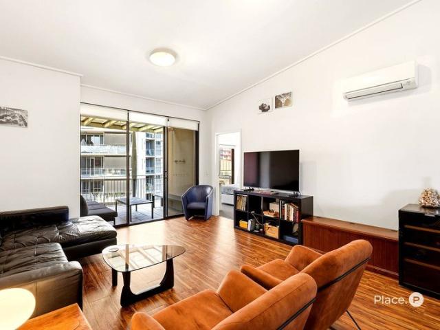 Top Floor Apartment with Raked Ceilings and Dual Balconies in Lifestyle Location