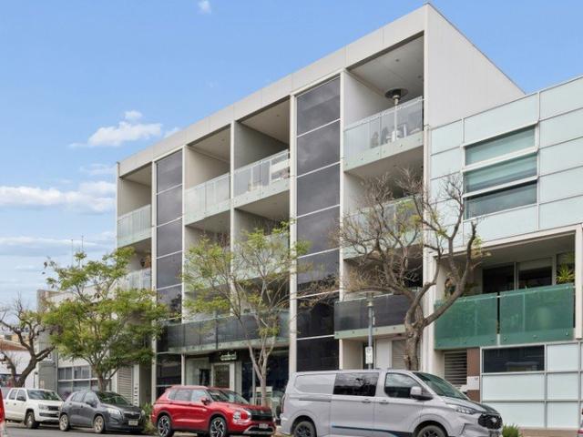 Top Floor Boutique Living with Light Filled Interiors & City Skyline Views!