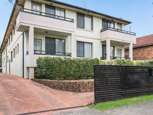 Top floor, front facing residence set in refurbished complex
