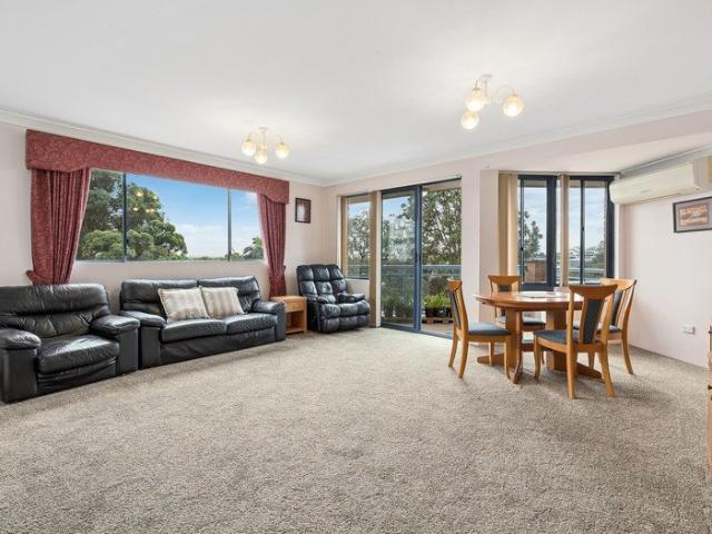 Top floor full brick apartment with light filled interiors and city views