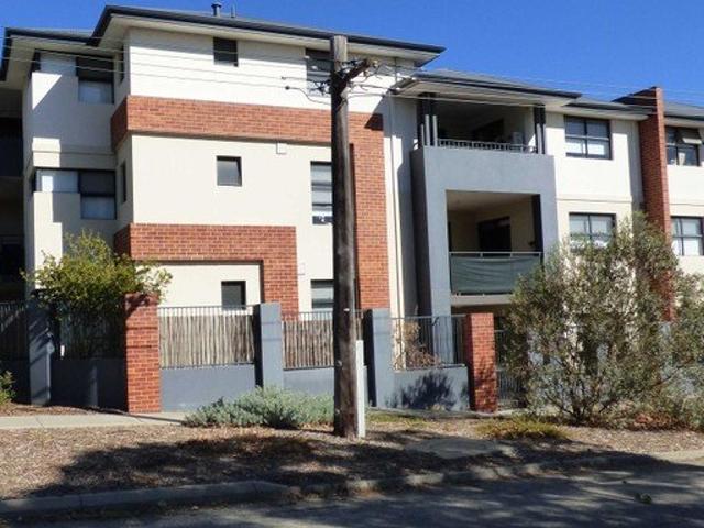 Top Floor Living in an Architecturally Designed Apartment!