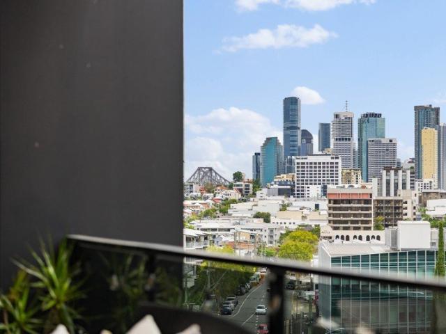 Top Floor Living with Oversized Balcony and City Outlook