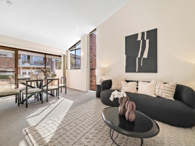 Top Floor Living with Soaring Ceilings