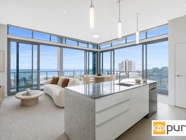 TOP FLOOR PENTHOUSE WITH PANORAMIC COASTAL VIEWS