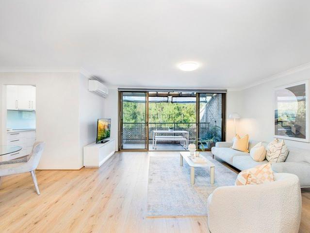 Top Floor Retreat with Large Entertainer's Balcony & Private Leafy Outlook