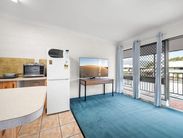 TOP FLOOR UNIT IN GATED COMPLEX