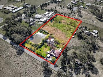 Top Quality 5 Acre Lot in Growth Area with Two Homes