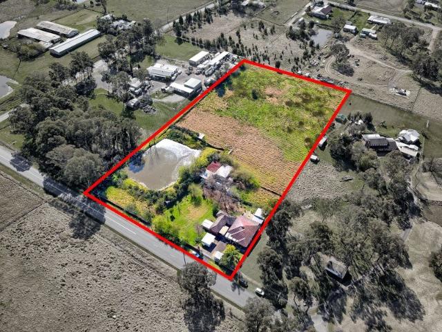Top Quality 5 Acre Lot in Growth Area with Two Homes
