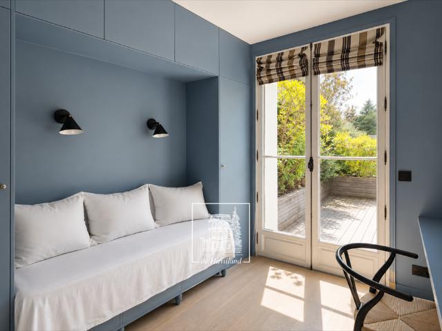 Tout savoir sur cette maison dans le quartier Ile de la Jatte Parc d'Orléans, à Neuilly sur Seine