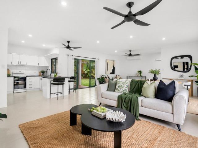 TROPICAL LIVING AT ITS FINEST REMARKABLY RENOVATED FAMILY RESIDENCE