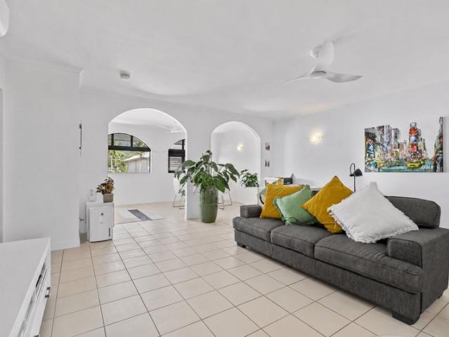 TROPICAL OASIS IN THE HEART OF HIGHLY DESIRABLE PALM COVE MOVE IN OR INVEST!