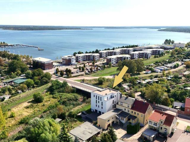 Traumhafte EG Wohnung am Tor zur Goitzsche auf 139 m² mit Seeblick, Balkon, Aufzug und Tiefgarage