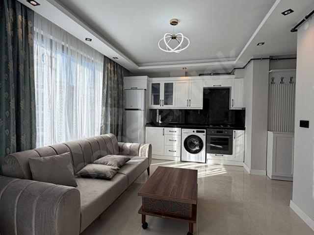 TRAMVAYA İKİ SOKAK KLİMALI,KOMBİLİ,EŞYALI SATILIK LÜKS 1+1 DAİRE