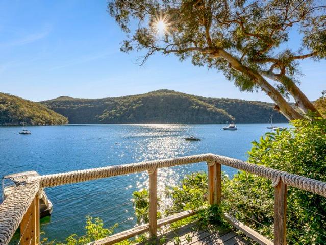 Tranquil Deep Waterfront Sweeping Water and National Park Vistas
