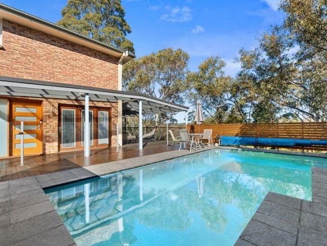 Tranquil Family Sanctuary with Sweeping Bush Valley Views and Exceptional Outdoor Living Access from 67 Beryl Avenue