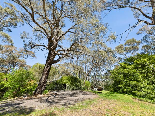 Tranquil Hilltop Retreat with Established Gardens and Significant Land