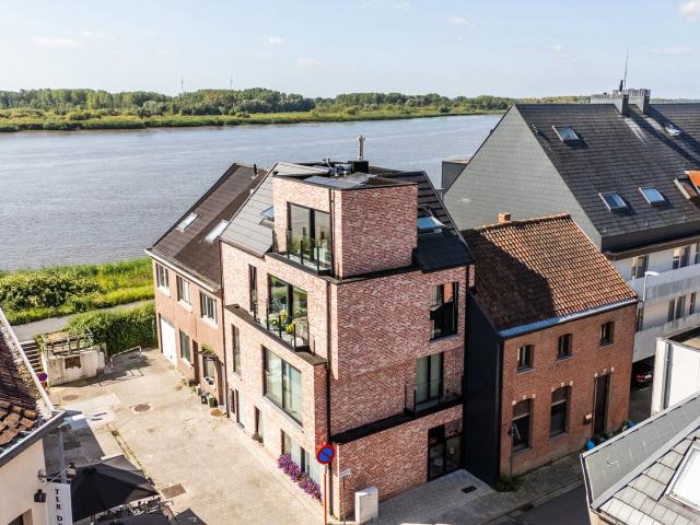 Trendy één slaapkamer appartement met magnifiek scheldezicht