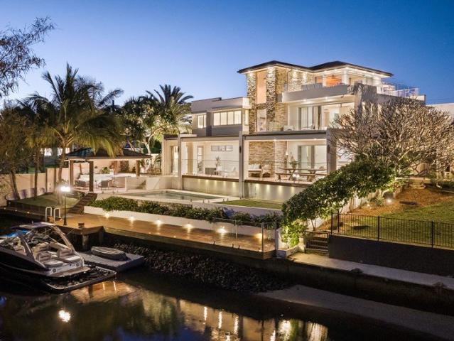 Tri Level Waterfront Entertainer Embraced by Panoramic Skyline Views