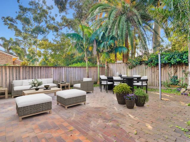 Tri Level Townhome with Expansive Courtyard in a Prime Leafy Setting