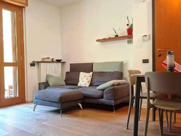 TRILOCALE ARREDATO E CONDIZIONATO CON GIARDINO E GARAGE