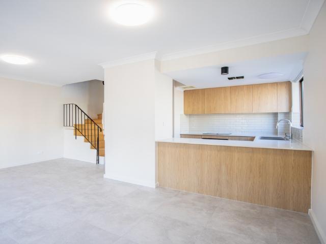 two bedroom townhouse in prime newtown location with parking access via rear lane