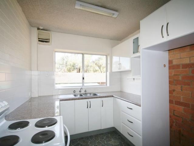 Two bedroom unit with carport and storage room!