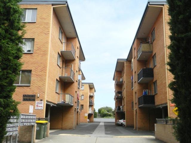 Two bedroom unit with carport and storage room!