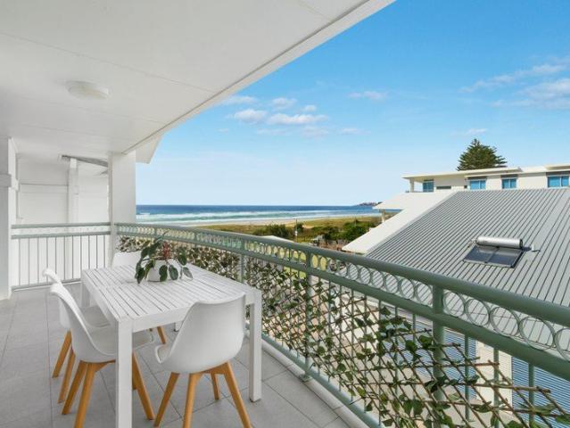 Two bedroom apartment with ocean views in beachfront building