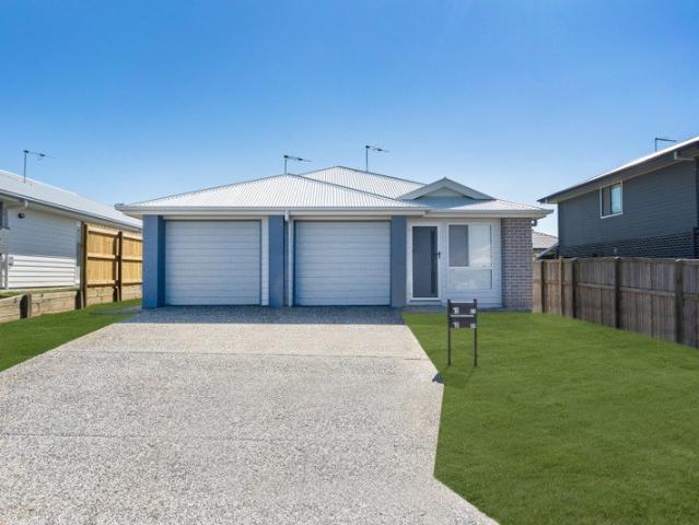 Two Bedroom Duplex With a Fully Fenced Backyard