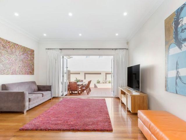 TWO BEDROOM SEMI WITH OUTDOOR COURTYARD AND OVERSIZED DOUBLE LOCKUP GARAGE