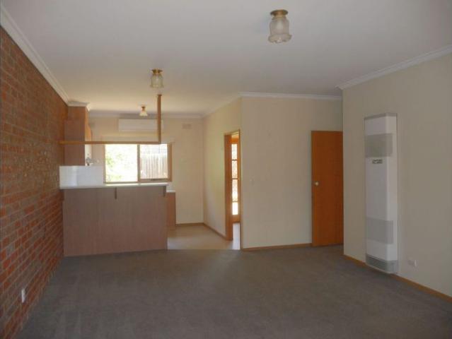 Two bedroom single story unit a short walk to Woolworths Newtown Supermarket