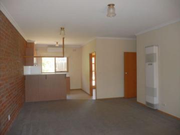 Two bedroom single story unit a short walk to Woolworths Newtown Supermarket