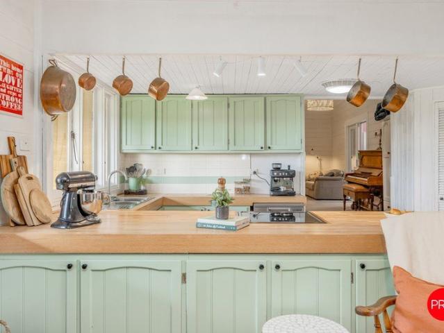 Two homes, 13 acres and a story worth staying for