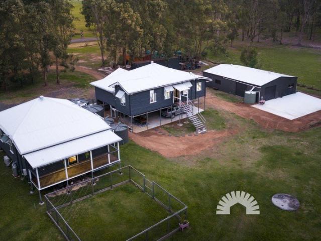 Two historic Queenslanders. One extraordinary 1.5 acre estate