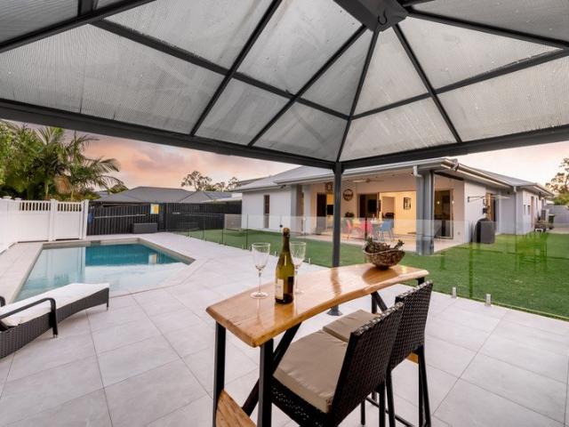 Two Master Suites, Pool & Exceptional Family Living in Genesis