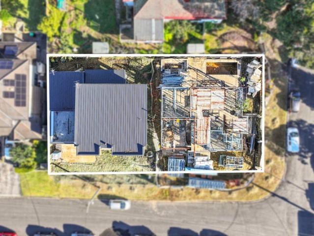 Two partially constructed homes on one site