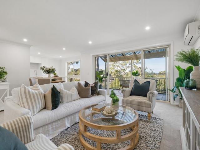 Turn Key Two Bedroom Living with Treetop and Water Glimpses