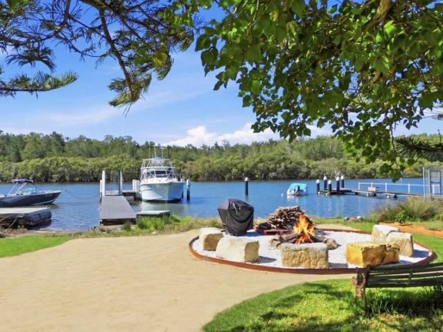 Turn Key Coastal Living with Deep Water Mooring and Jetty