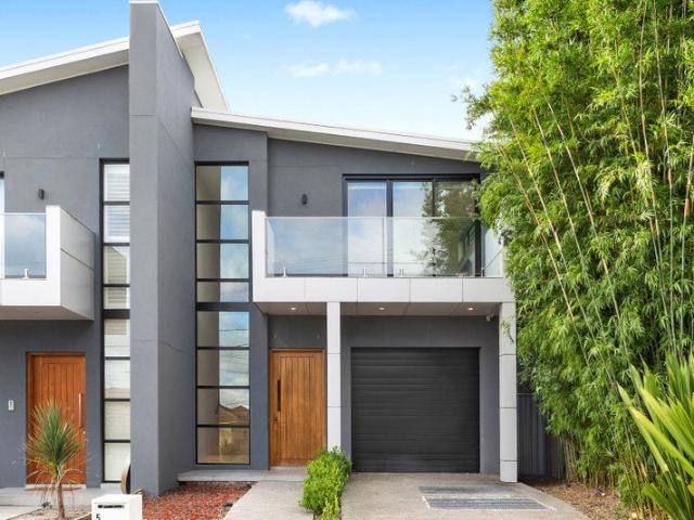 Turnkey Family Duplex Makes Immediate Impression with Style and Quality