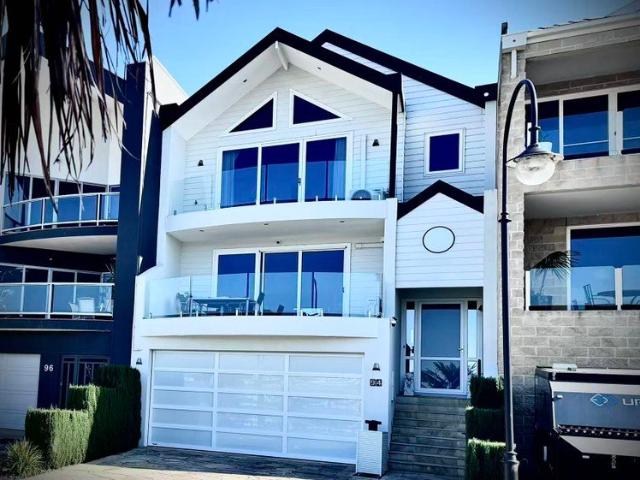 Ultimate Waterfront Prestige: Tri Level Dream Home with Private Dock and Marina Plus River Views