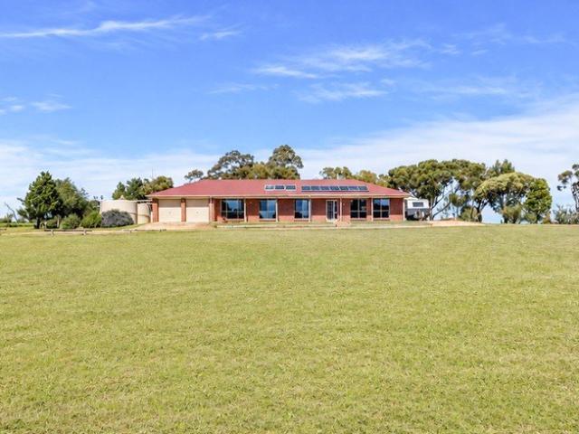 Ultimate Country Escape Offering Acreage Luxury and Town Convenience