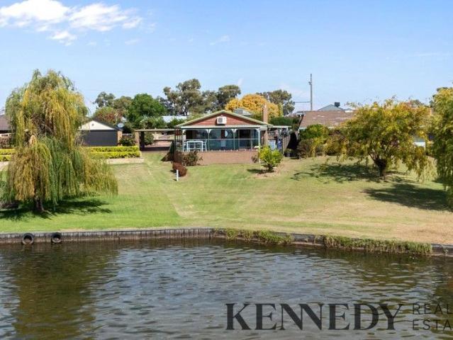 Lakefront Living with Endless Potential