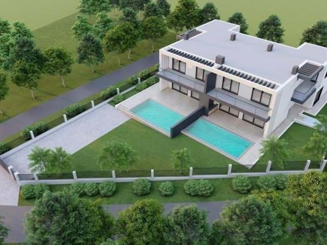 Uma bela moradia geminada NOVA virada a sul com vista para uma piscina privada e jardim