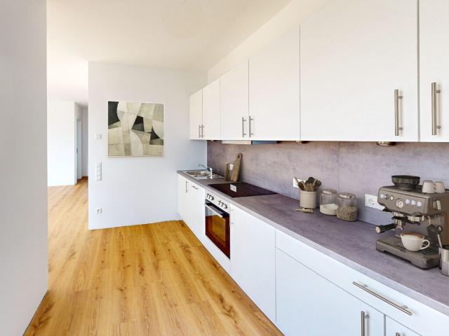 Loftcharakter auf 2 Zimmern! Neubauwohnung mit EBK und Balkon/Terrasse