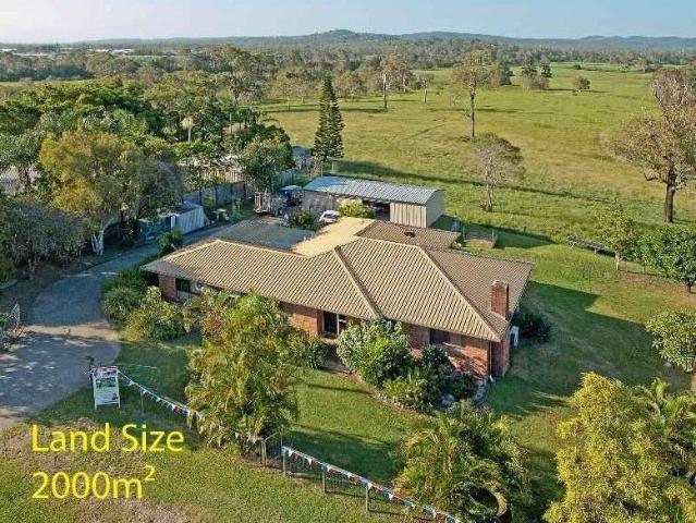 Undeveloped Acreage Style Living A Stone's Throw from Major Amenities!