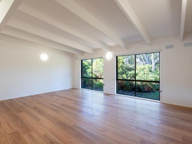 Unfurnished, fully renovated beachside gem!