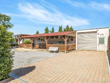 Unieke houtmassieve woning met magazijn