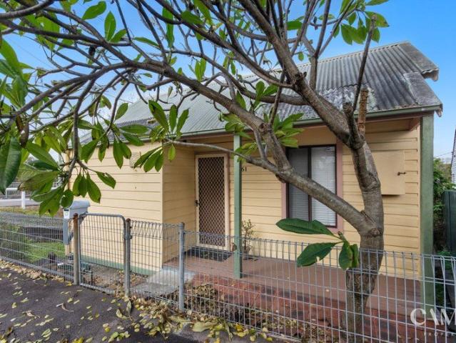 Uninterrupted water views meet endless potential in this renovator's delight