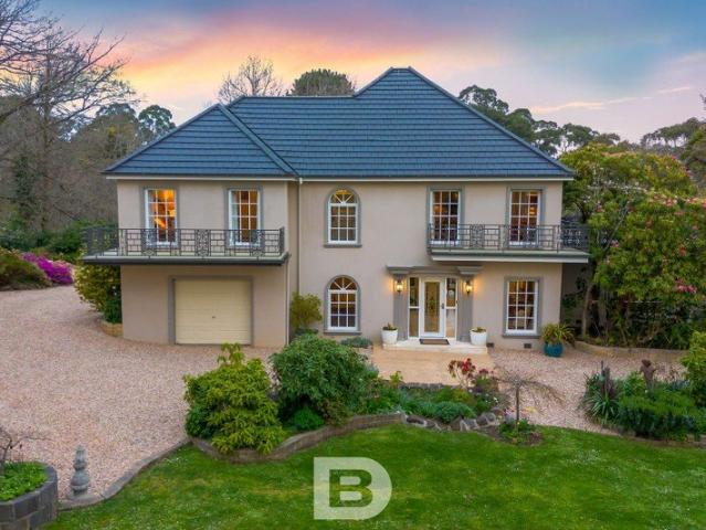 Unique Country Manor with Timeless Acreage Appeal