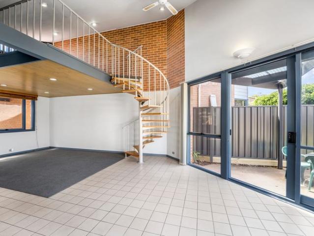 Unique Mezzanine Style Unit with Spacious Living and Private Courtyard